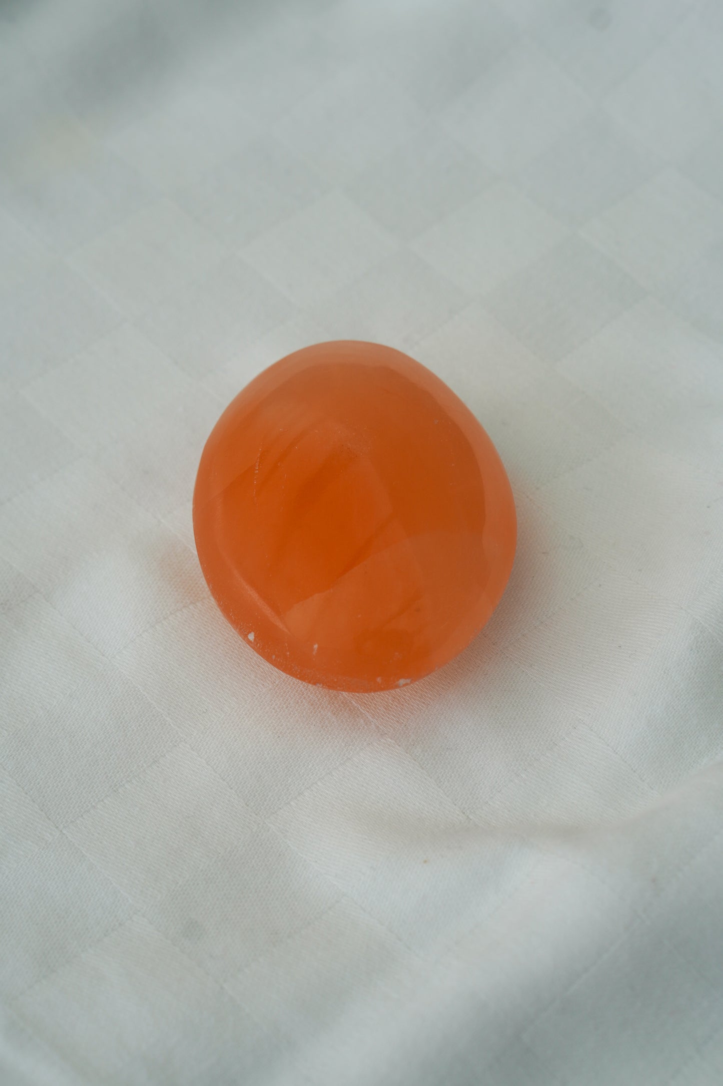 Selenite orange pocket stone