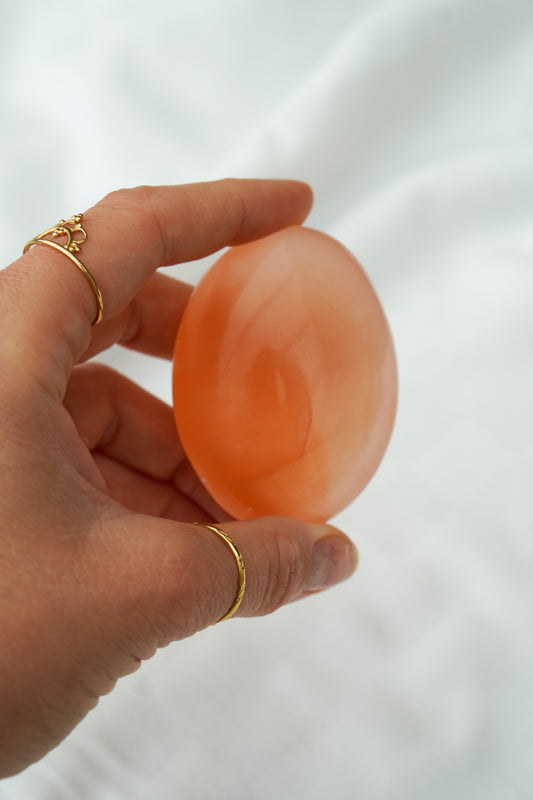 Selenite orange pocket stone